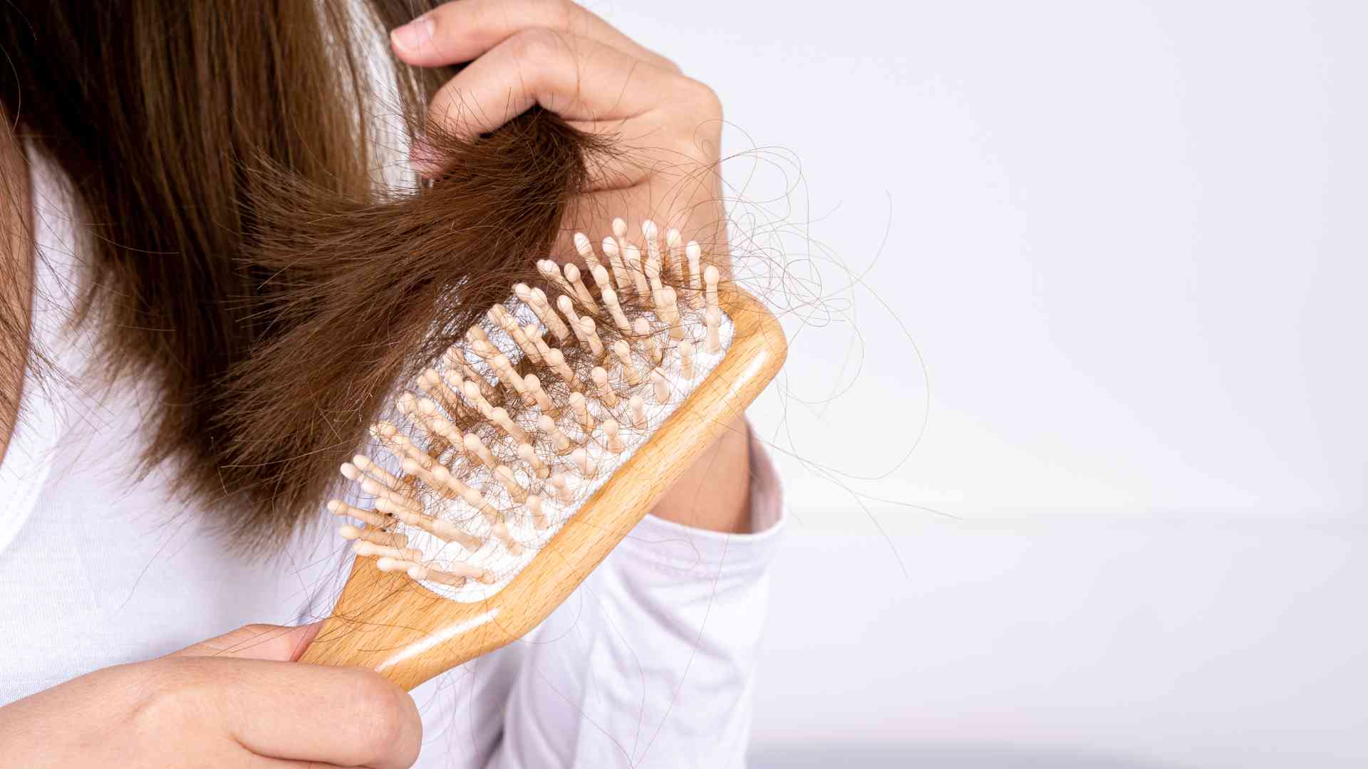 Can you explain the connection between hormonal changes and hair loss