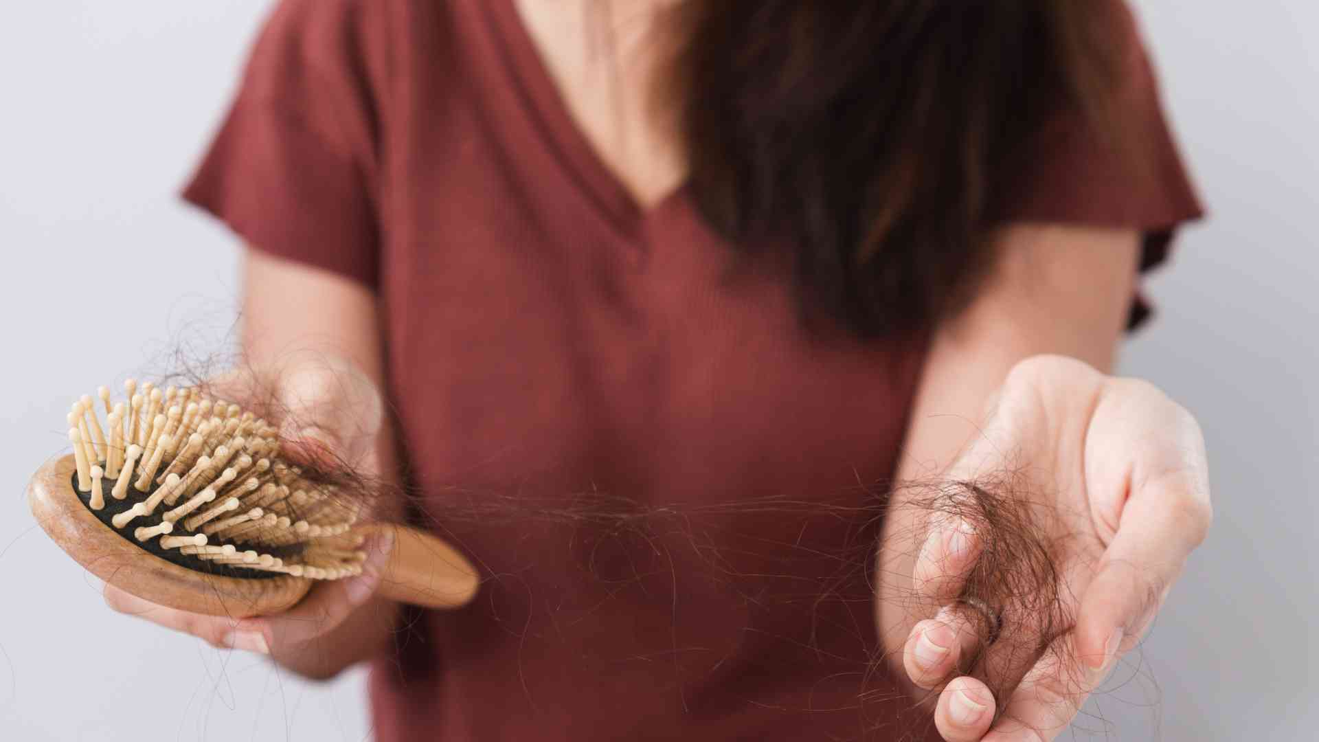 Can you explain the connection between hair loss and autoimmune disorders